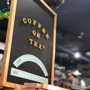 a sign that says coffee or tea