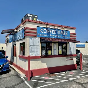 a car parked in front of a coffee shop