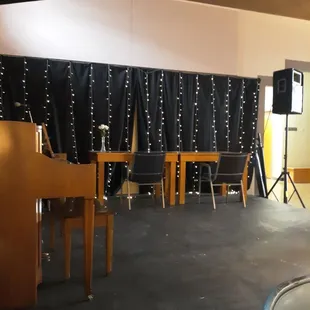 Performing stage that's converted to additional lounge/study space.