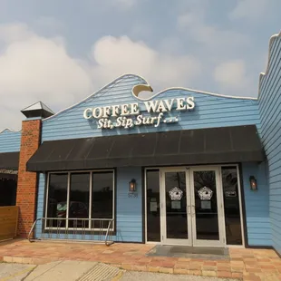 the entrance to a coffee shop