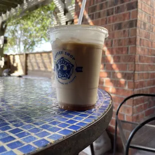 Iced Caramel Macchiato while sitting outside on the covered patio