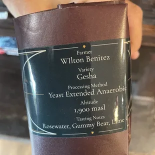 a person holding a cup of coffee