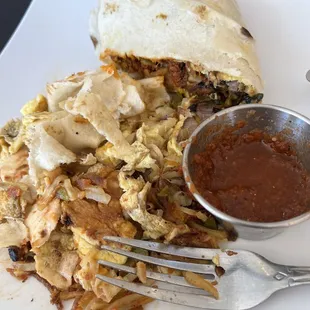 Breakfast burrito, partially eaten