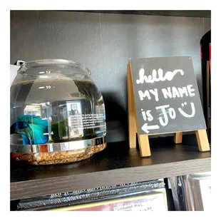a glass jar with a sign on it