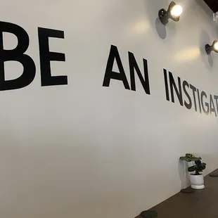 a wall with a sign that says be an institution