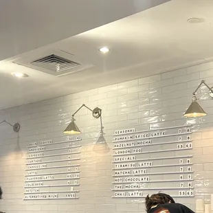 two men working at a counter in a coffee shop
