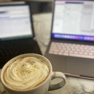 a cup of coffee and a laptop