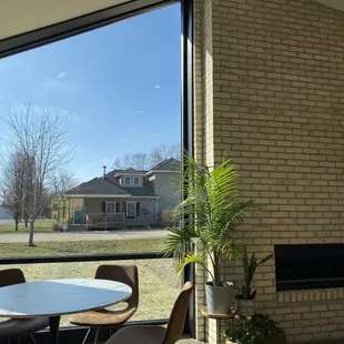 Large windows and fireplace in seating area