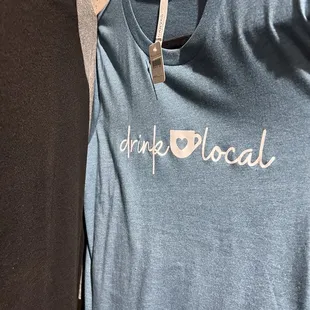 two t - shirts with the word drink local on them