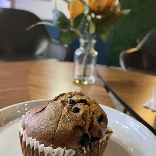 a muffin on a white plate