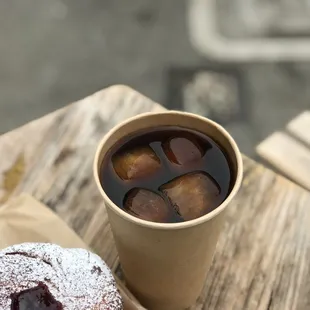 a cup of coffee and a doughnut