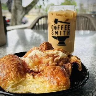 a plate of pastries and a cup of coffee