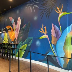 Beautiful mural. The artist also has some original art for sale on the Nomad Wall.