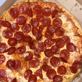 a pepperoni pizza in a box
