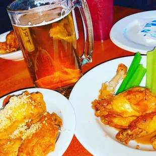 a beer and a plate of wings