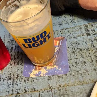 a plate of food and a glass of beer