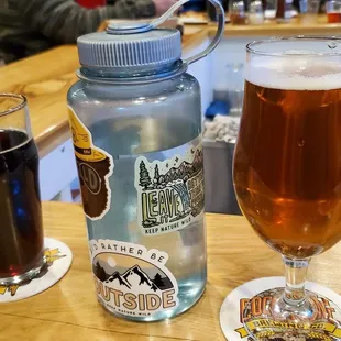 a glass of beer and a bottle of beer