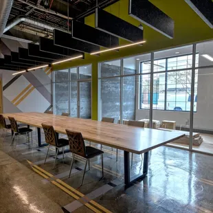 a conference room with a long table and chairs