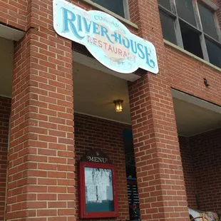 Sign looks as old as the building.