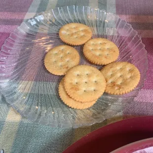 Plate of unwrapped crackers.
