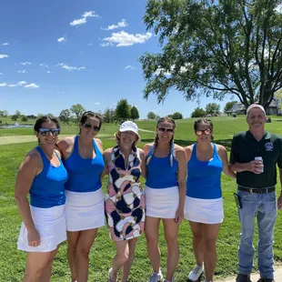 a group of women's golf players posing for a picture