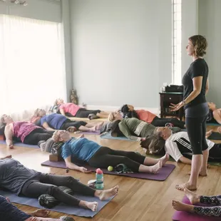 Kristen leading a Therapeutic Yoga class at COIL Yoga