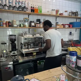 a man working in a coffee shop