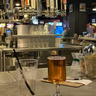 a glass of beer on the bar