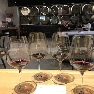 three glasses of wine on a table