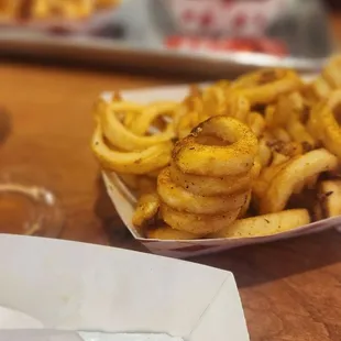 a plate of french fries and a burger