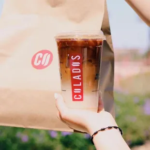 a person holding a paper bag