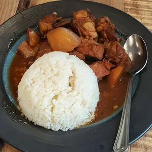 a plate of food on a wooden table