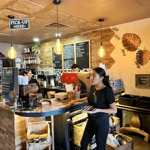 a woman standing at the counter