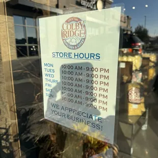 a store hours sign
