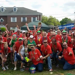 a group of people wearing red shirts