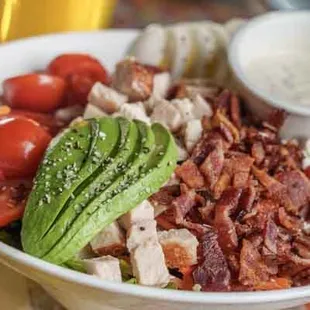 A delicious Cobb Salad with fresh sliced avocado.