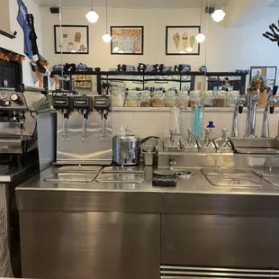a stainless steel kitchen with a sink