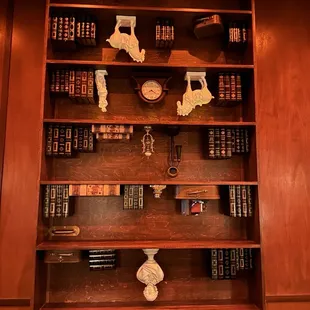 Upside down bookcase entrance from next door&apos;s Blue Collar bar.