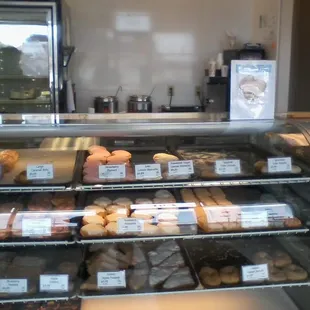 A display case filled with donuts.