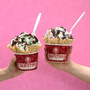two ice cream cones with sprinkles