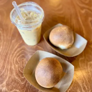 Egg, cheese and bacon Bollos, an iced oat milk latte with a pump of vanilla.