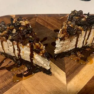 a slice of cheesecake on a wooden board