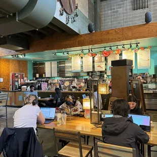 Lots of communal tables with plug outlets.