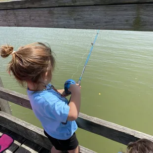 Our granddaughter fishing for the first time.