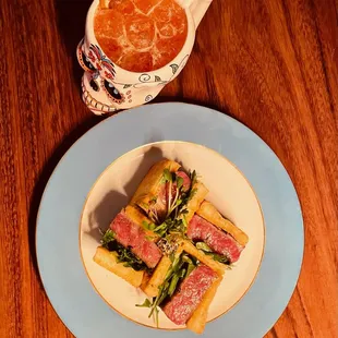 a bowl of soup and a plate of sandwiches