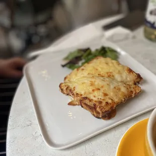 a plate of food and a cup of coffee