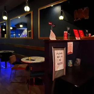 tables and chairs in a dimly lit room