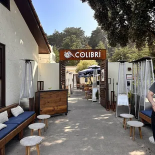 a woman standing in front of a restaurant