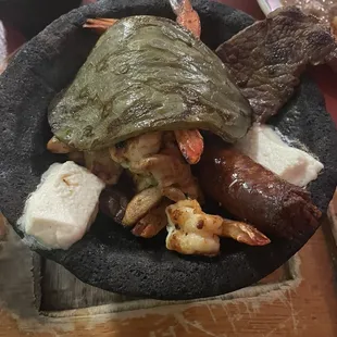 Molcajete with garlic sauce on the side