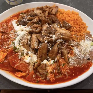 Red chilaquiles with pollo asada